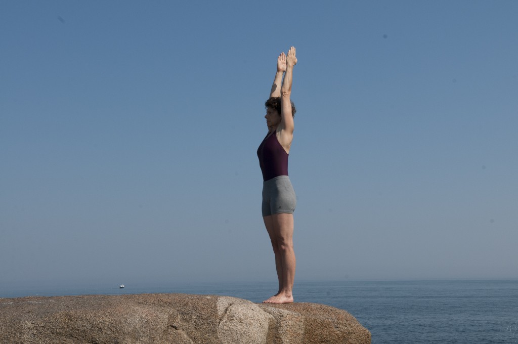 Lyengar ® Yoga Instructor Demonstrates Urdhva Hastasana (Standing).